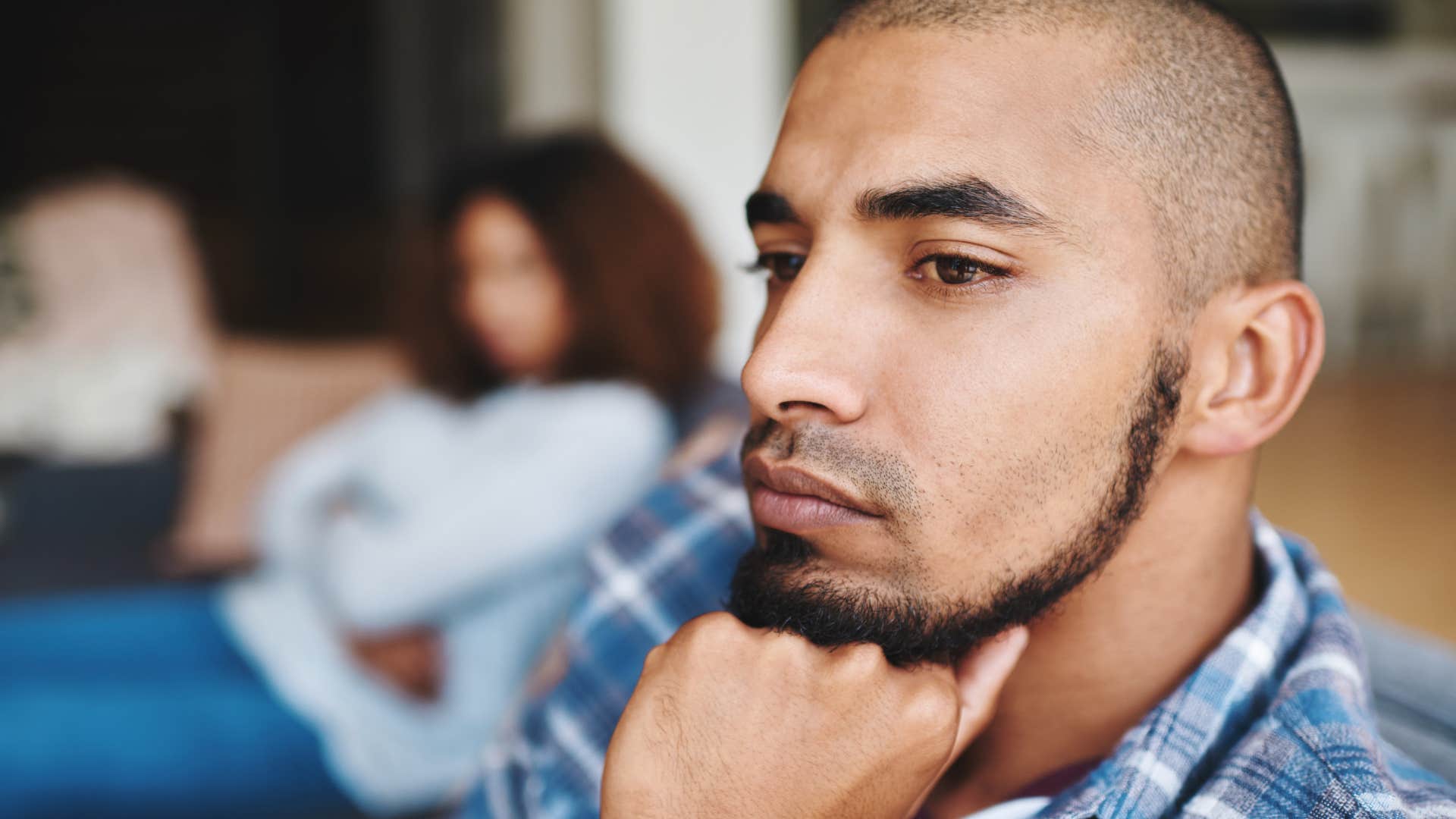 man looking upset after picking a fight with his wife