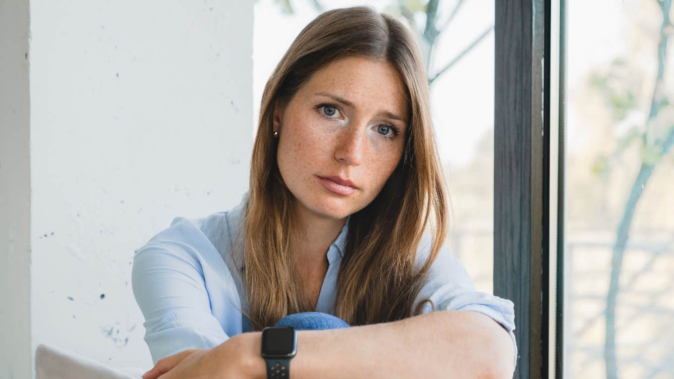 miserable woman sitting at home