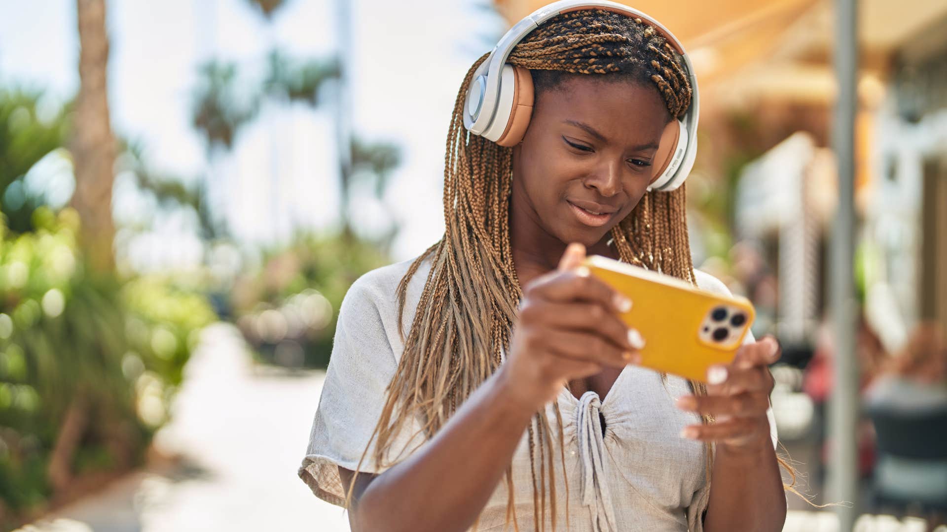 Woman spending more time filming than living her life.