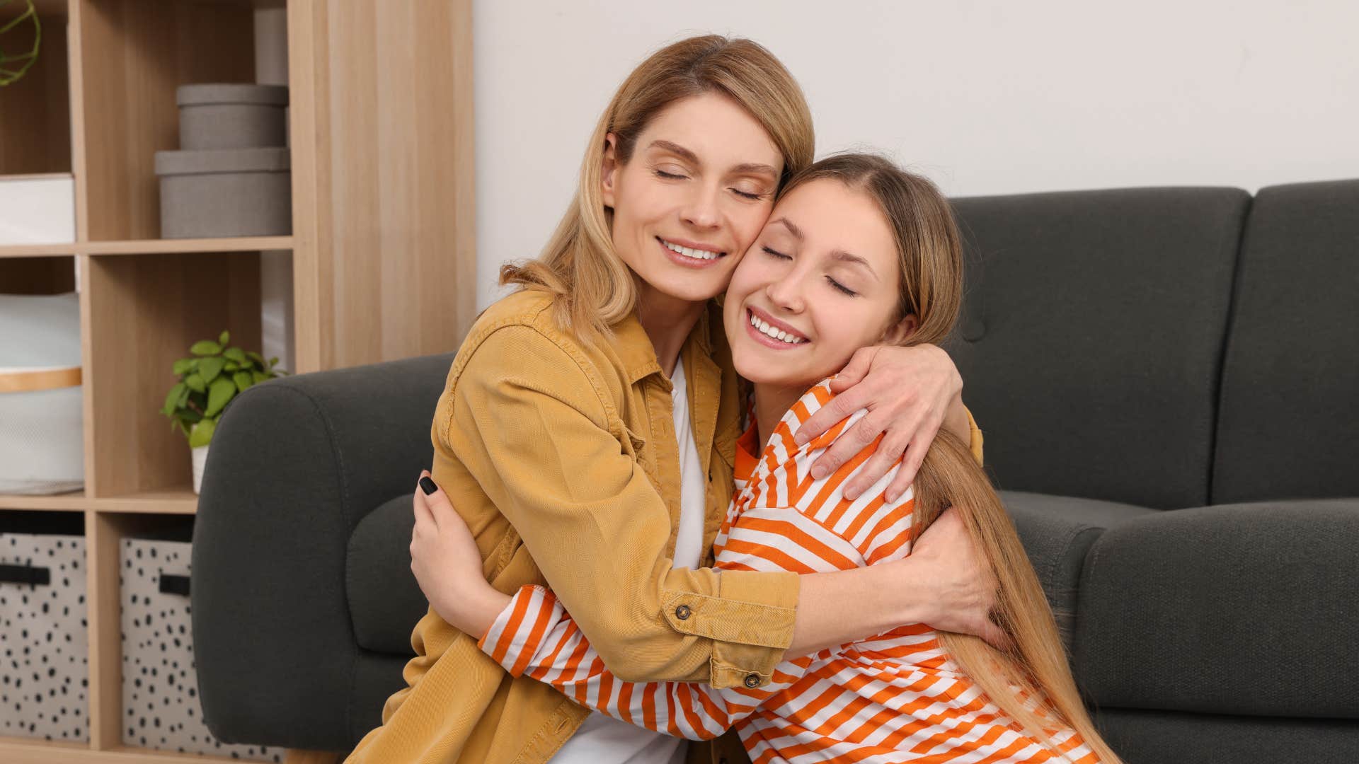 mom and daughter hugging on floor