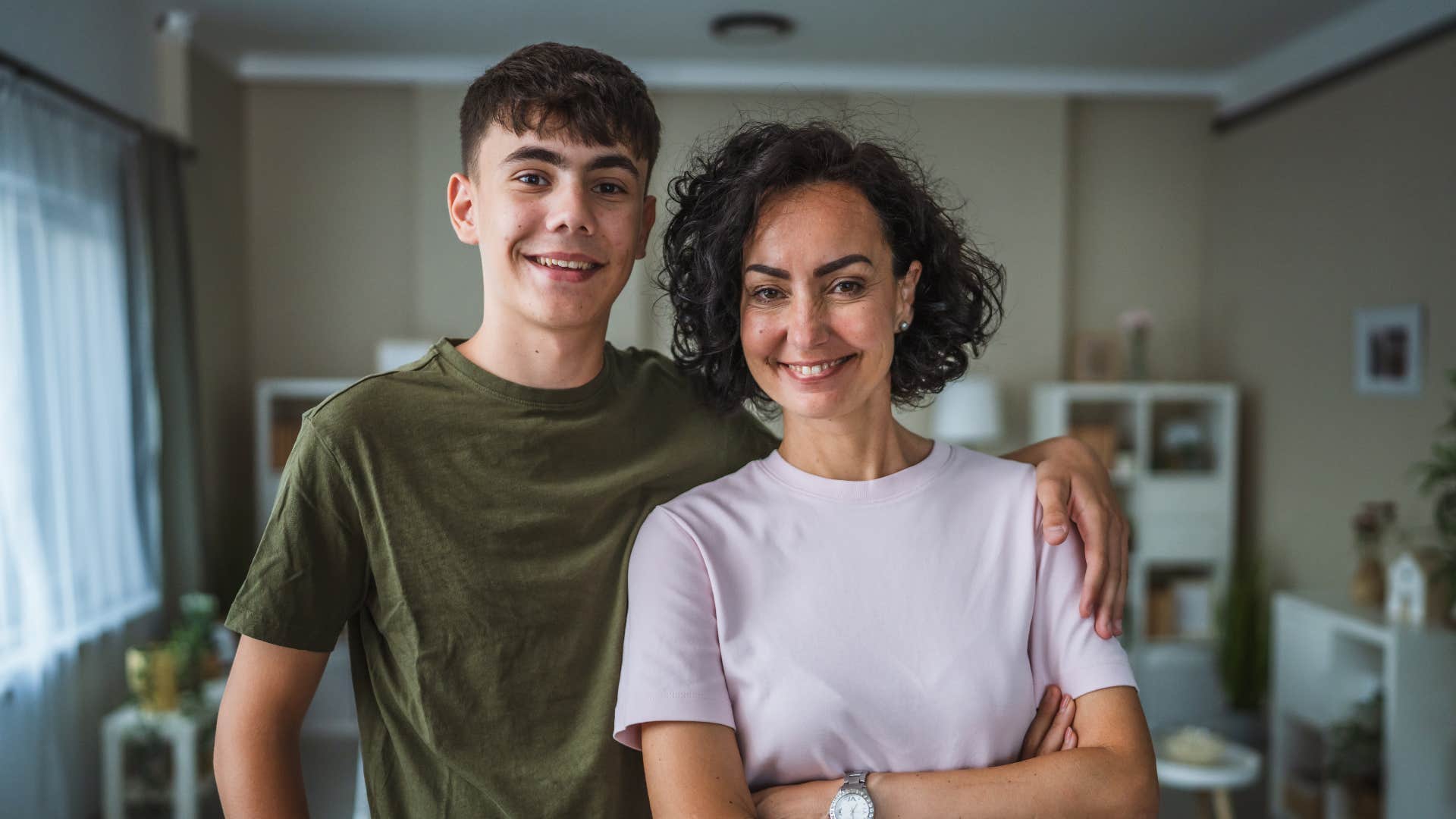 son standing next to his mom his role model