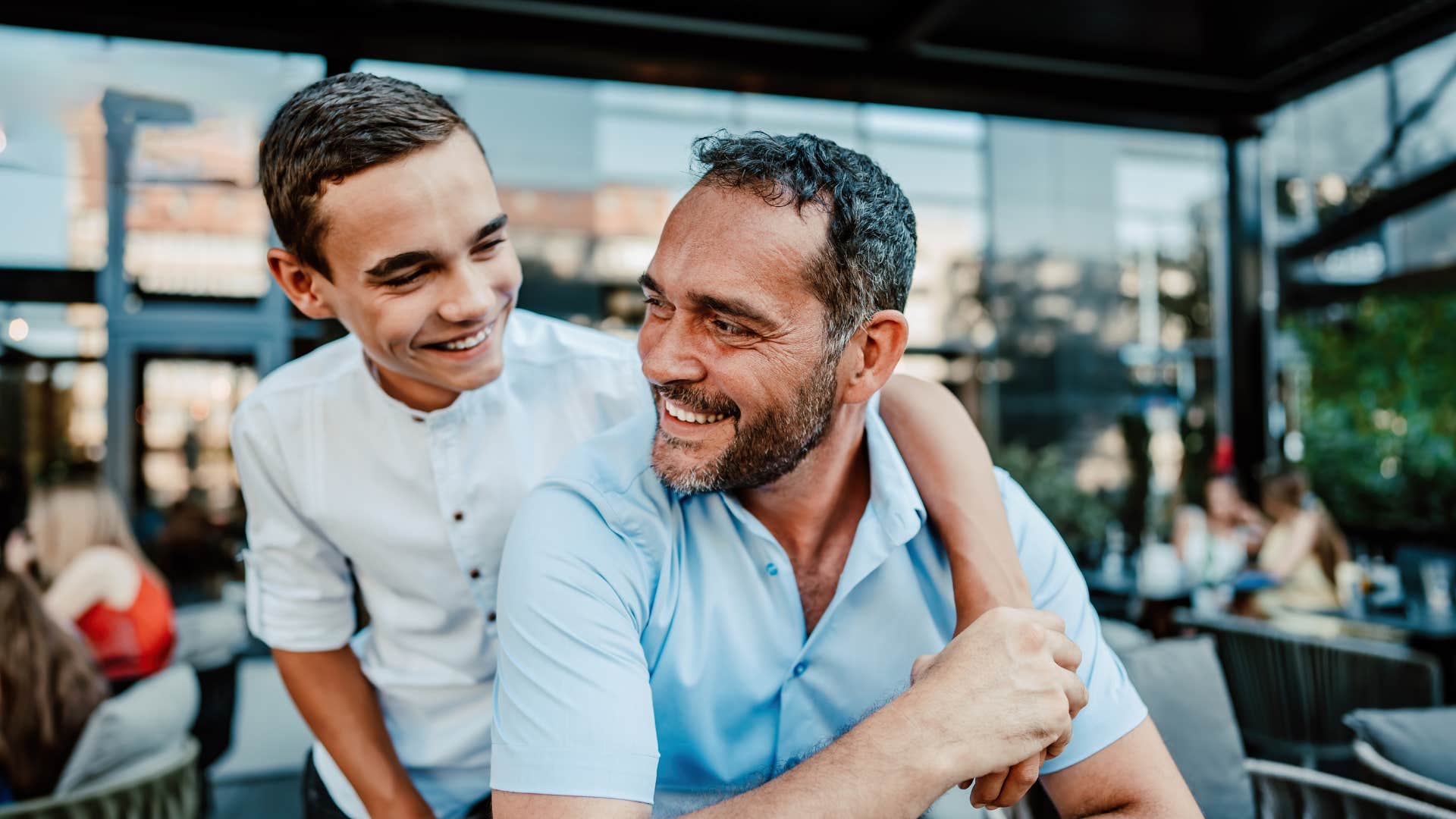 father and son hugging 