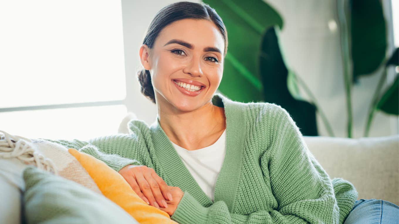 woman who has her life together sitting on her couch