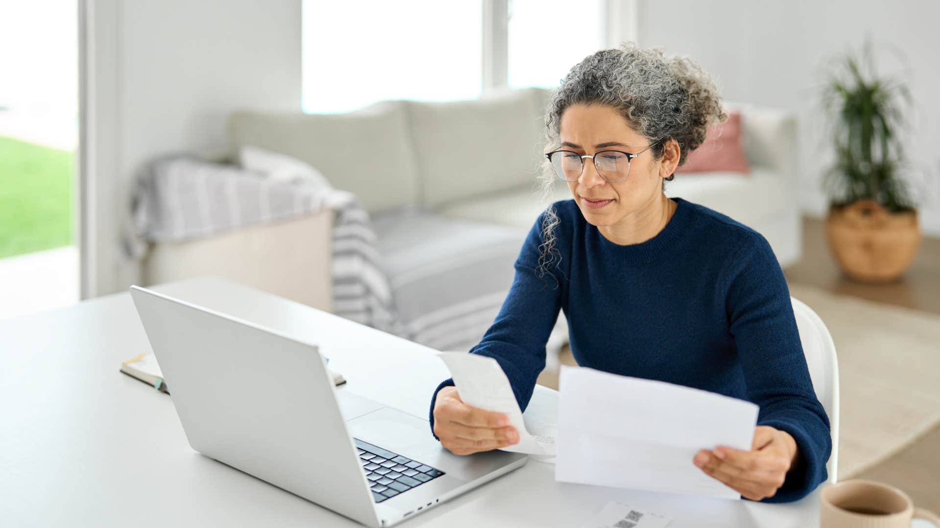 woman paying bills on laptop