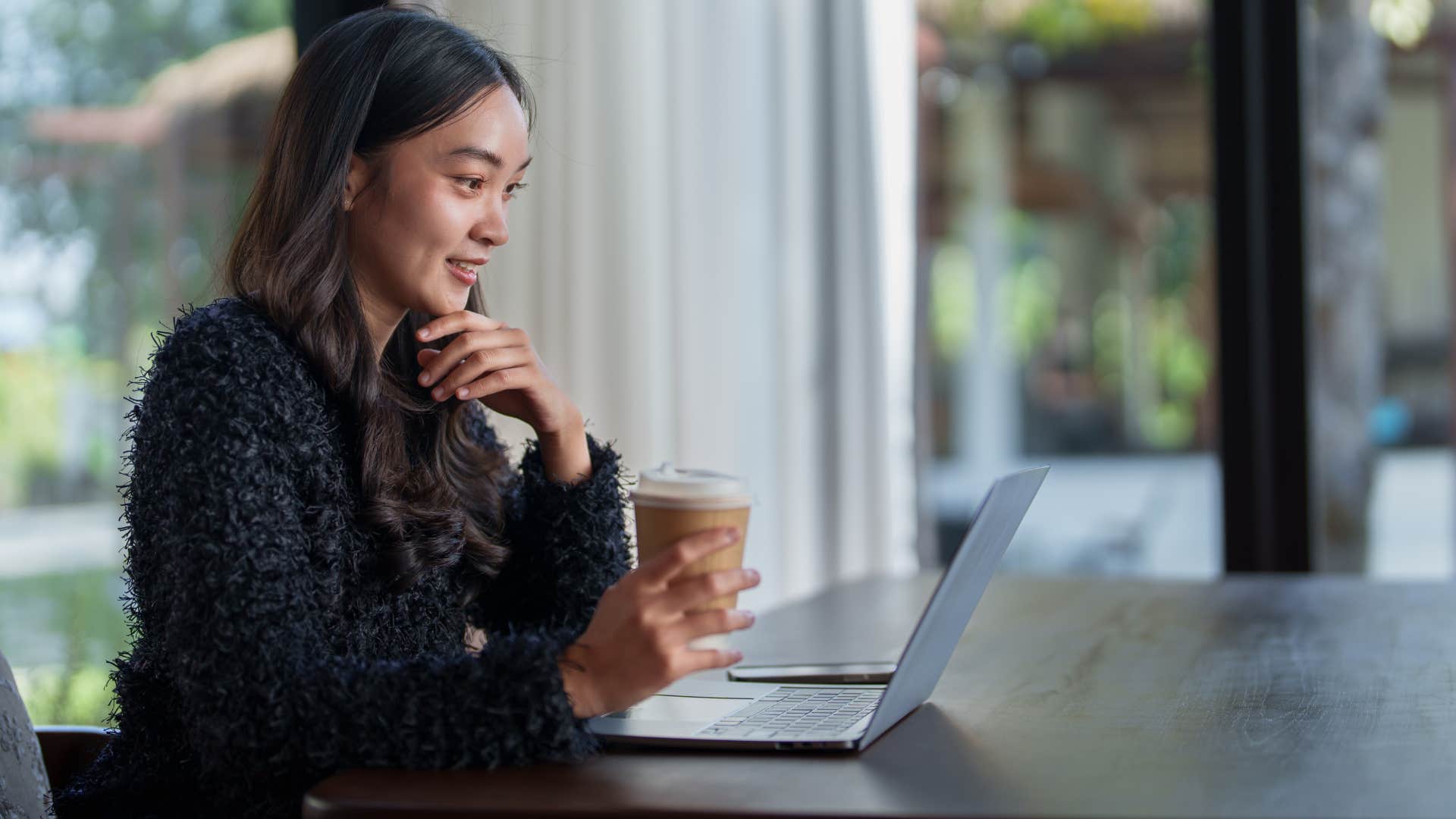 woman working with valuables near windows