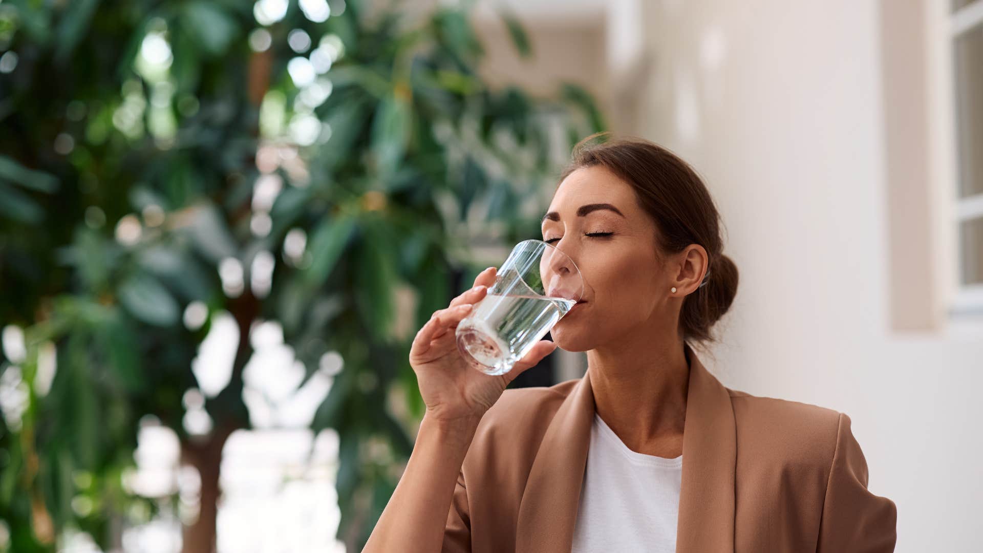 woman drinking glass of water