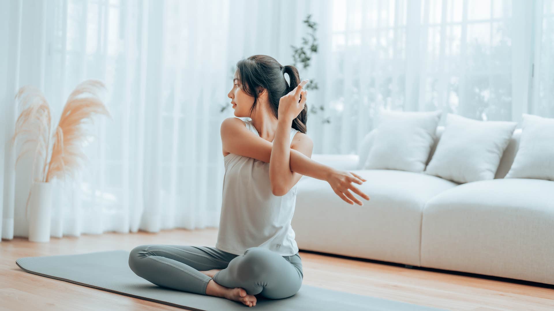 woman stretching on the floor at home