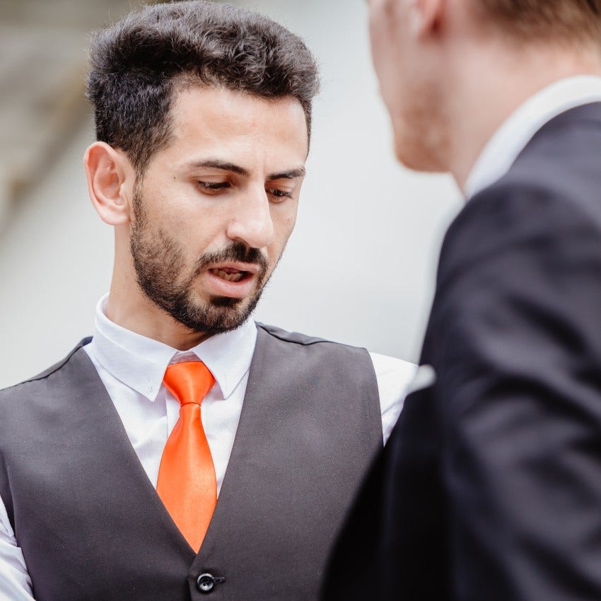 man who avoids eye contact as it reveals how he feels about other man