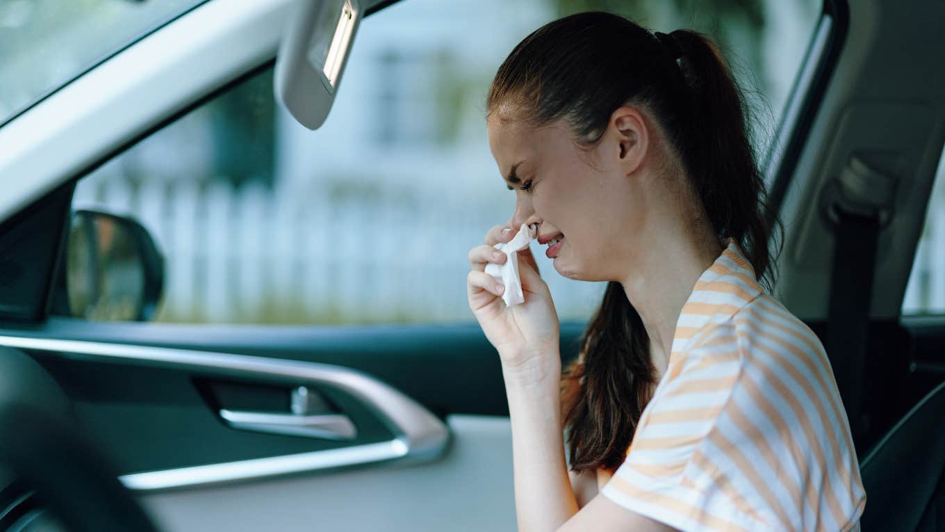 woman crying in her car after Ulta employee insulted her