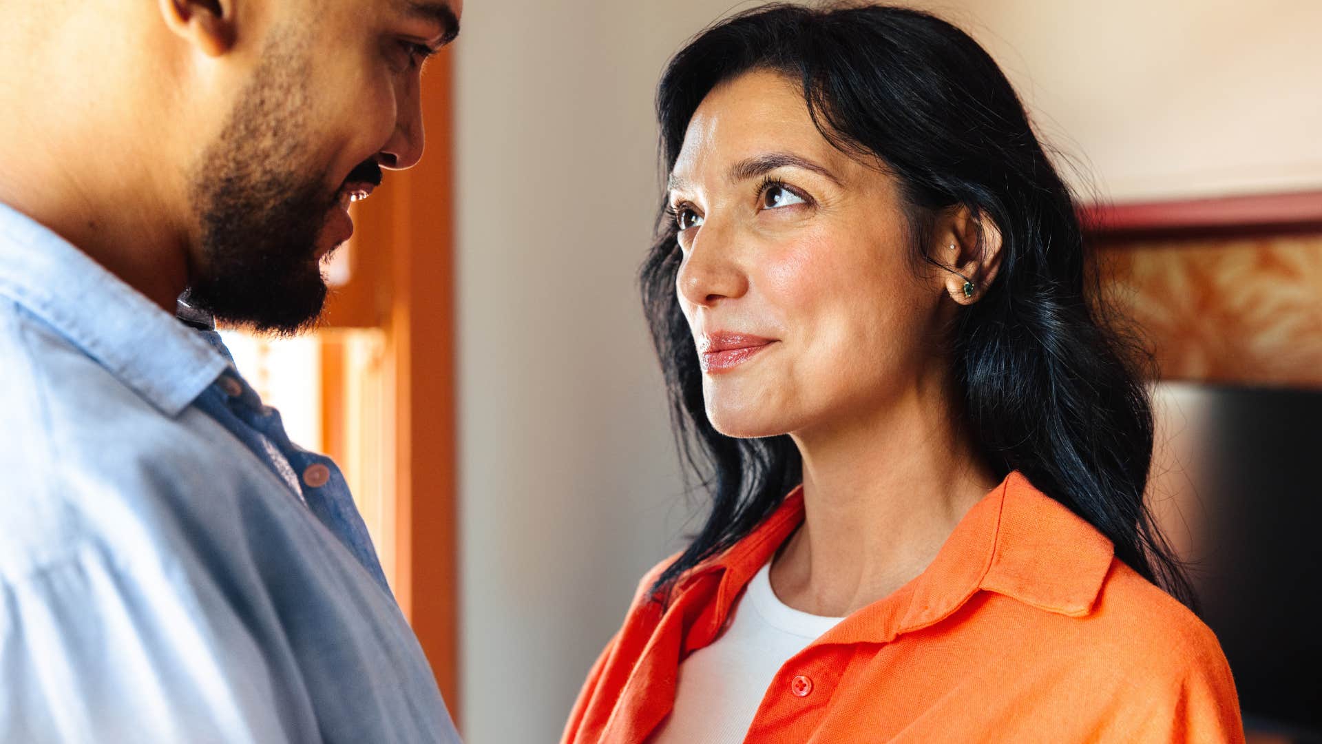man looking at his happy wife who makes him feel chosen