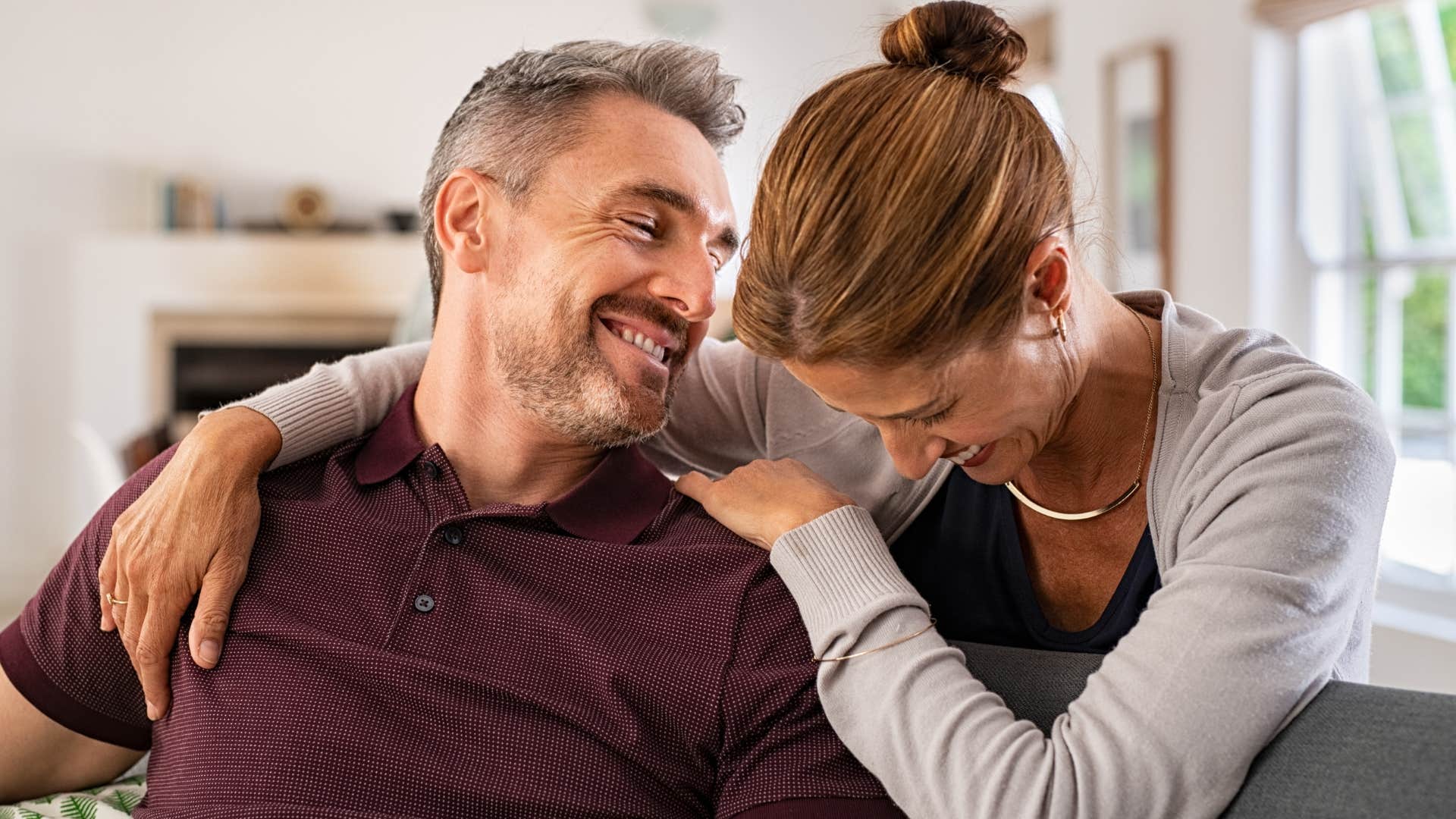 man smiling at his wife who makes small moments feel special