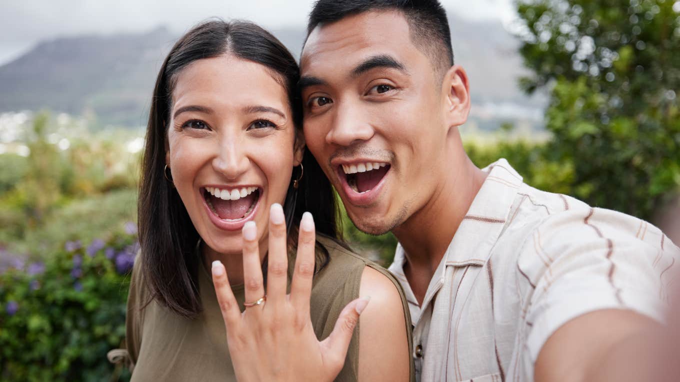 engaged couple showing off ring