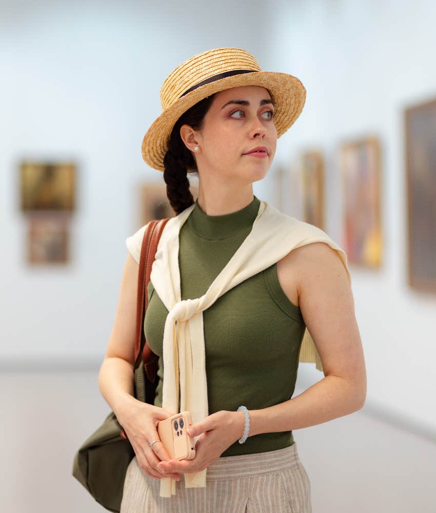 woman viewing art in gallery