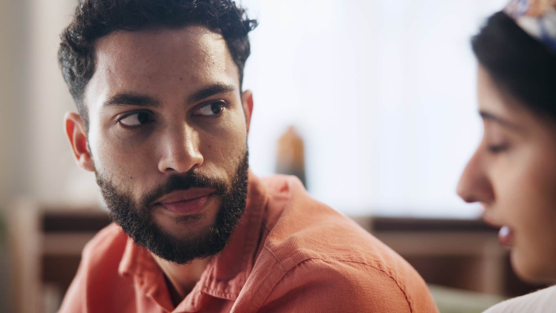 man who's overly agreeable to everything talking to his wife