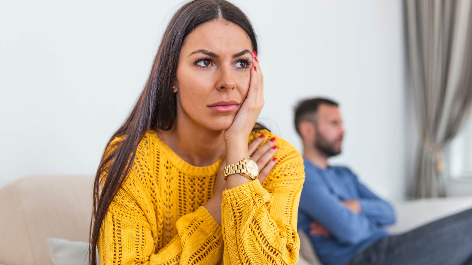 woman turned away from her husband who's stopped complimenting her