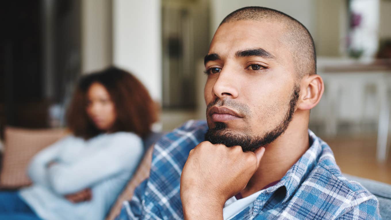 husband quietly falling out of love with wife turned away from her