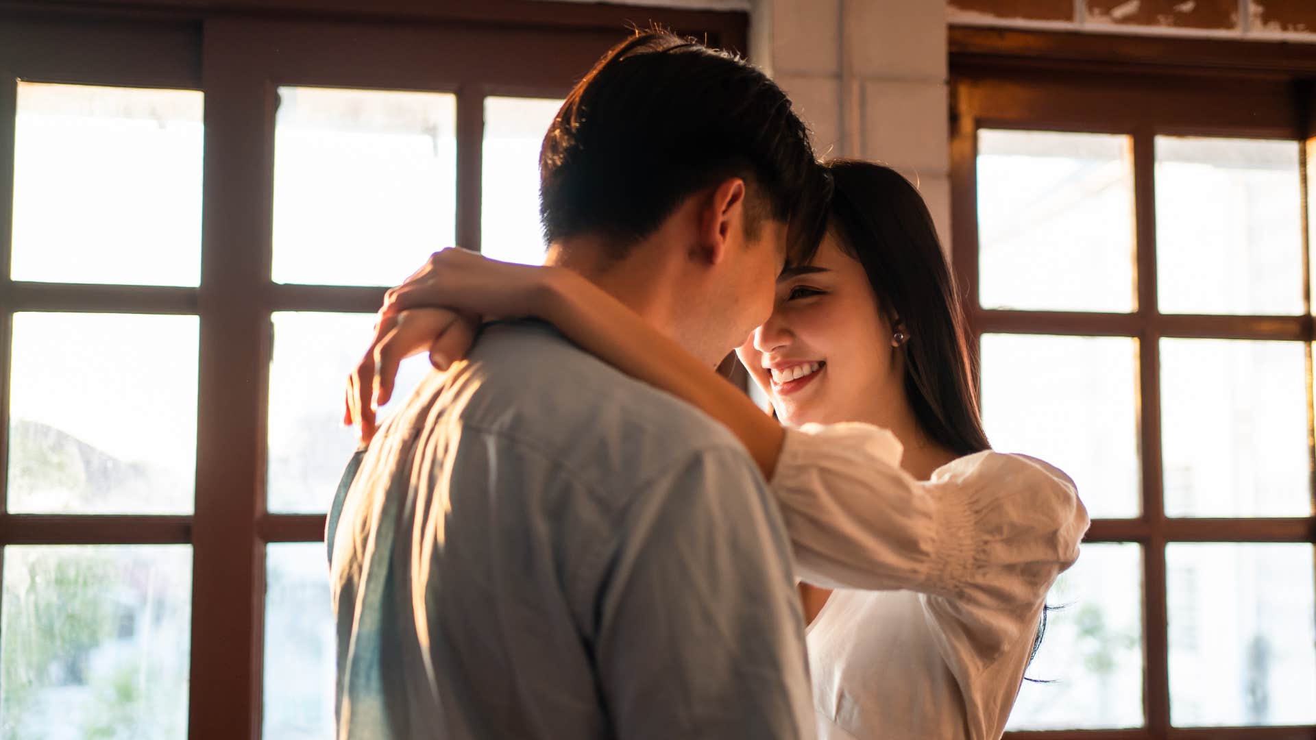 couple hugging looking into each others eyes