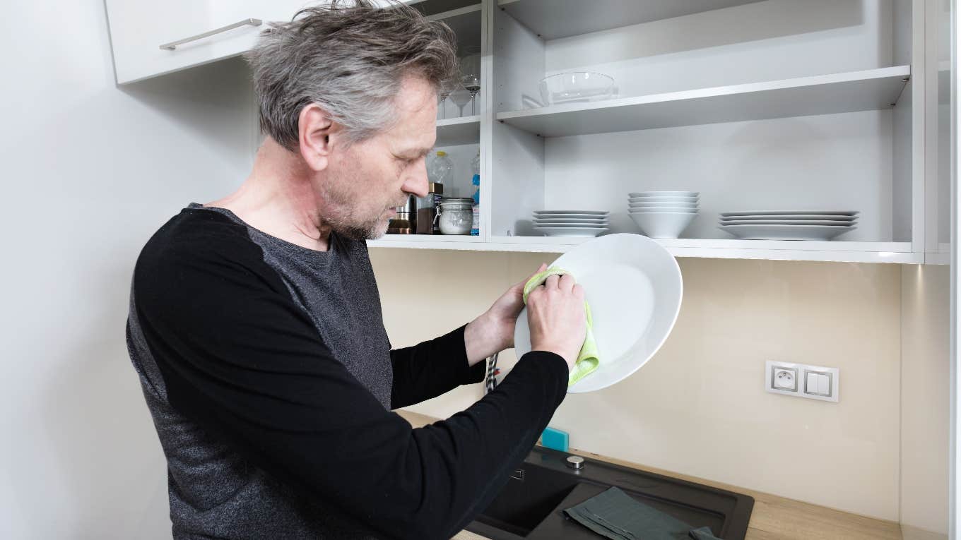 widower who is annoyed because he has to do the dishes himself