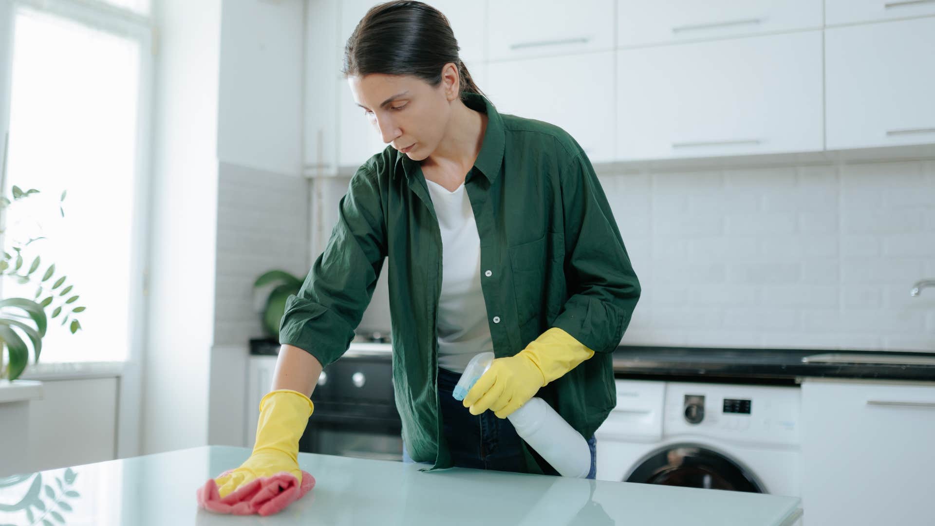 unhappy woman cleaning at home