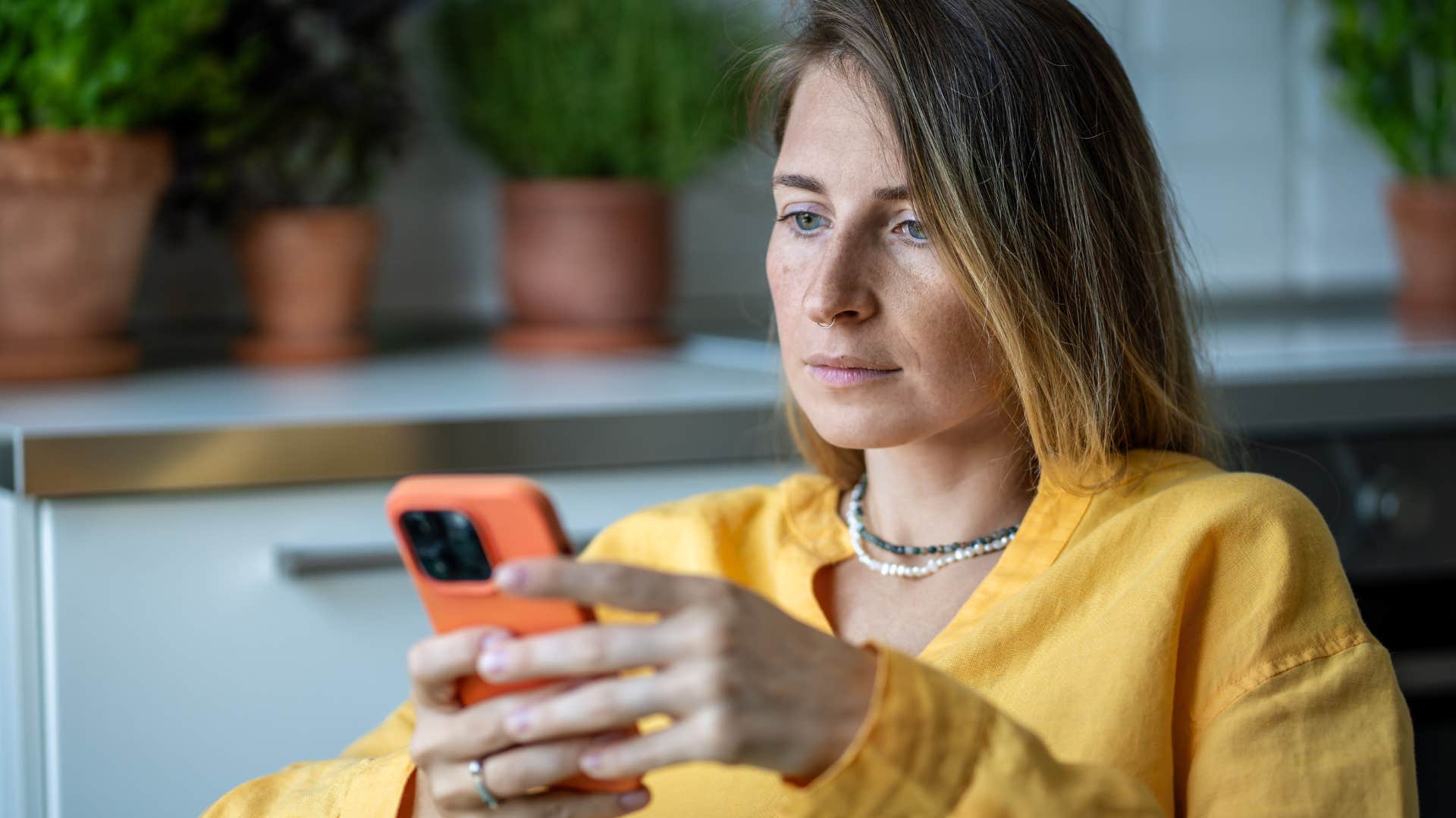 unhappy woman on her phone
