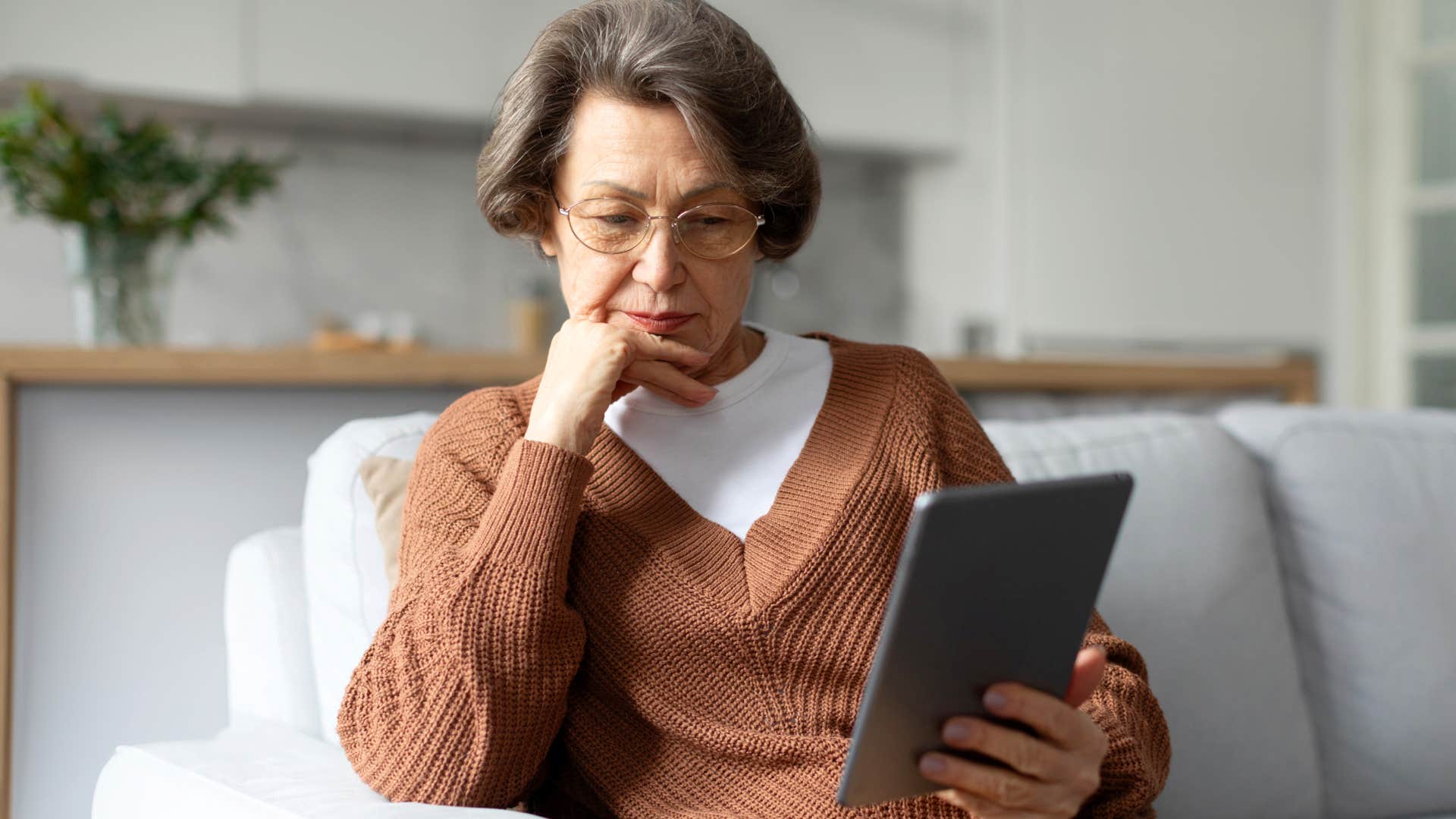 unhappy woman consuming a ton of self-help content