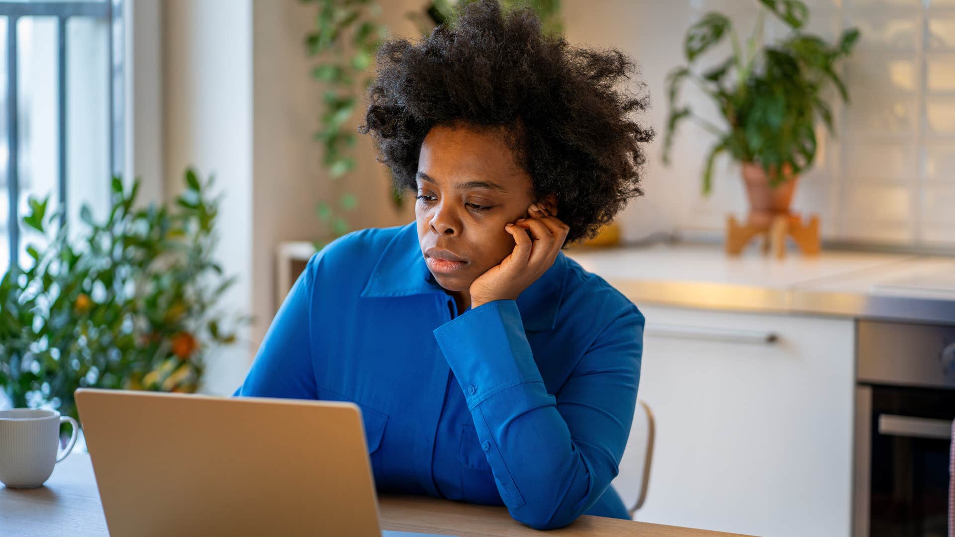woman who has unhealthy vices looking at her laptop