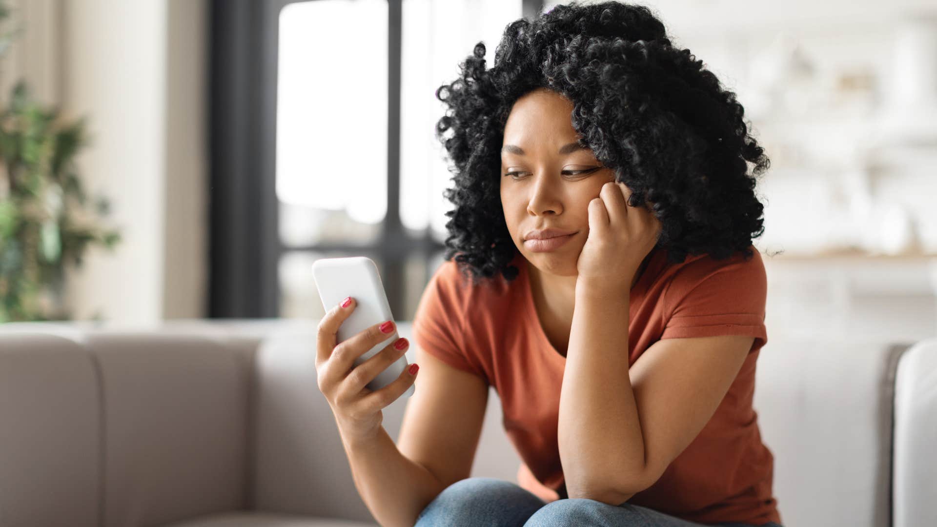 sad unhappy woman ignoring her phone