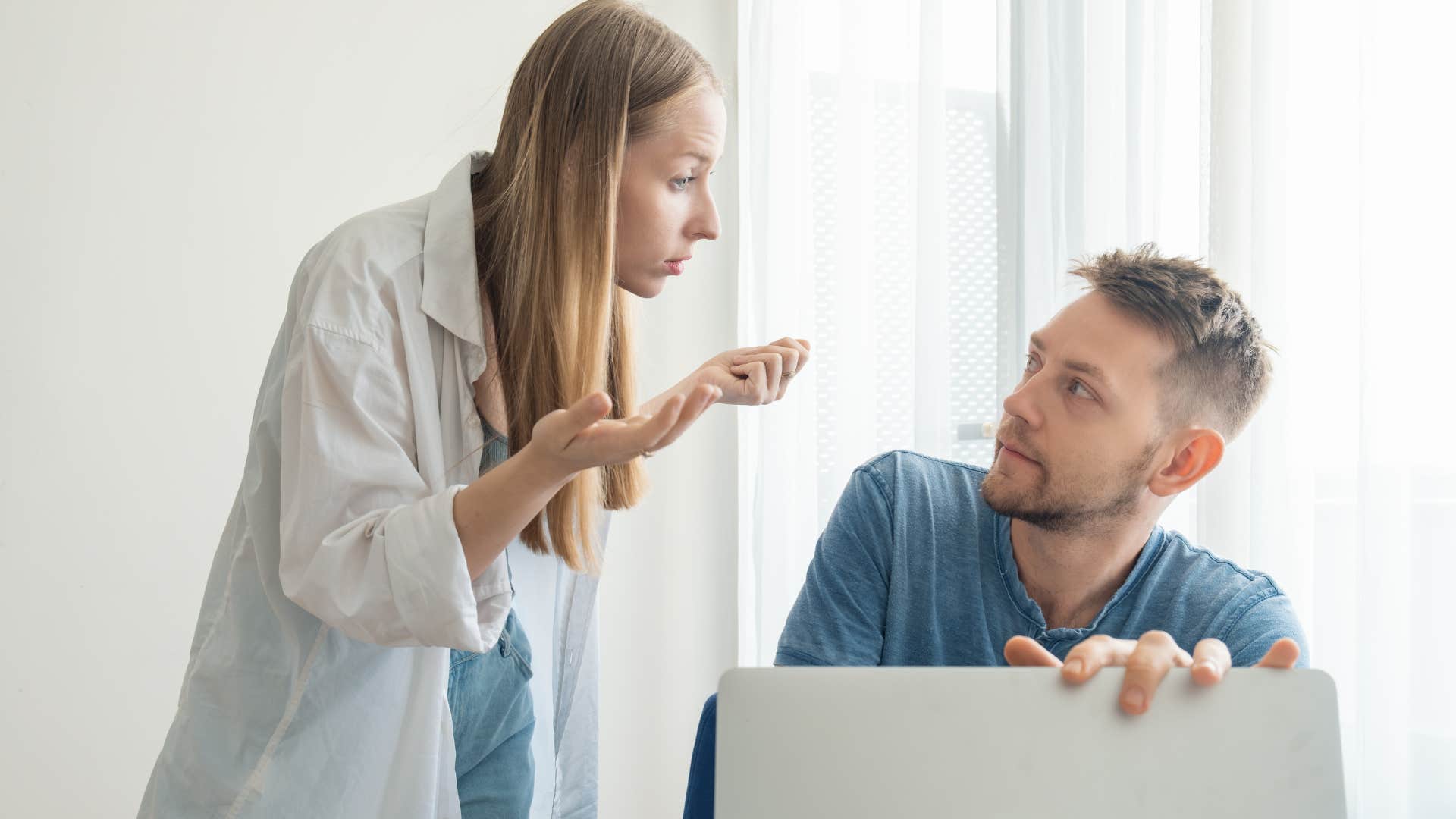 unhappy woman micromanaging her partner