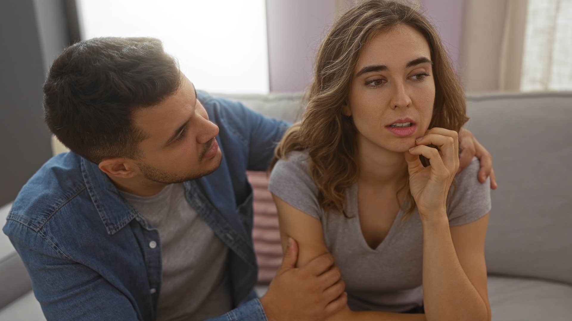 upset woman asking partner to hold her