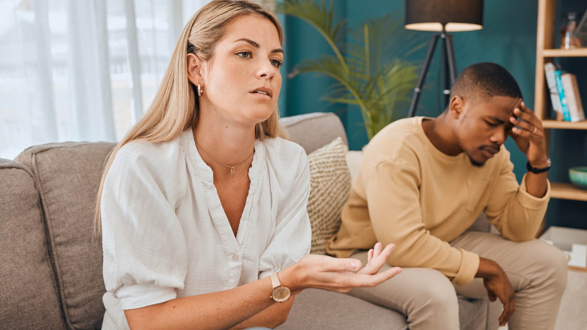 woman not feeling well telling annoyed husband