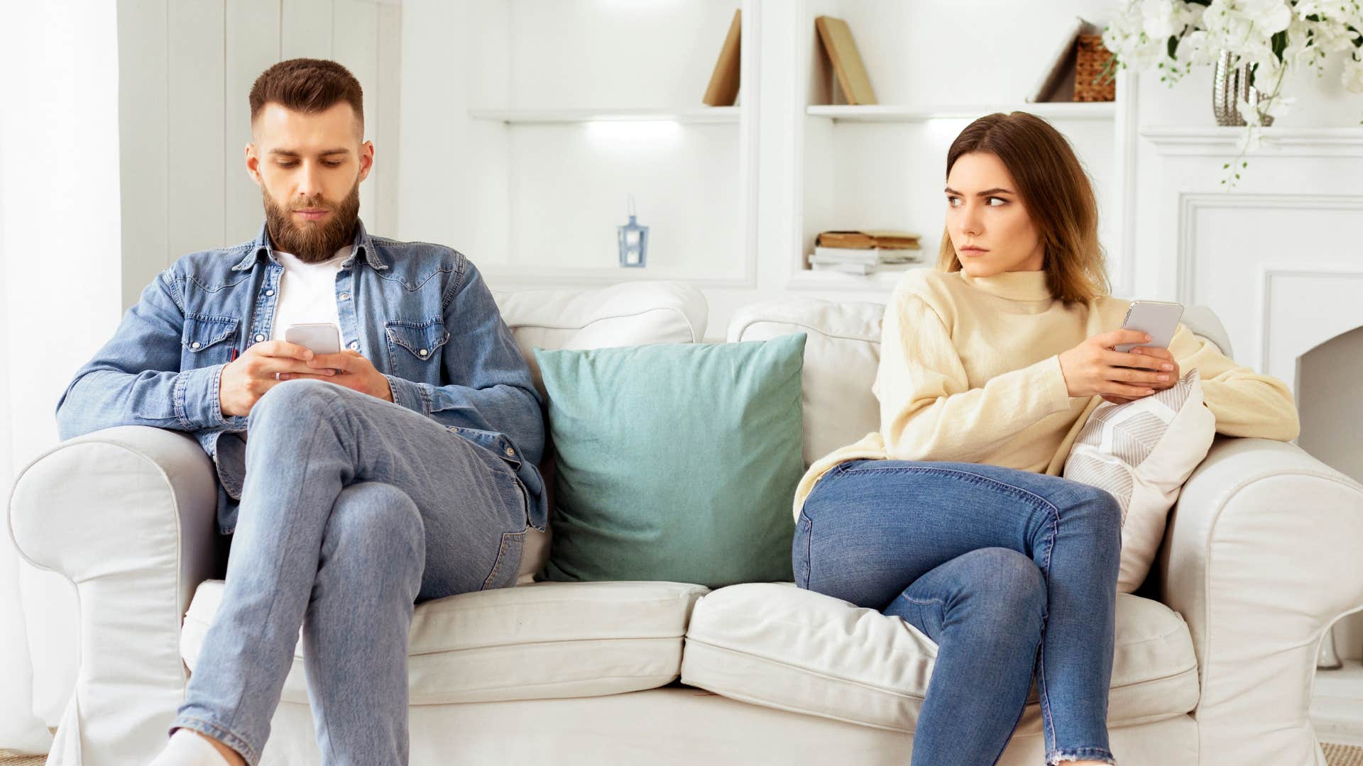 upset woman who is over it sitting opposite husband