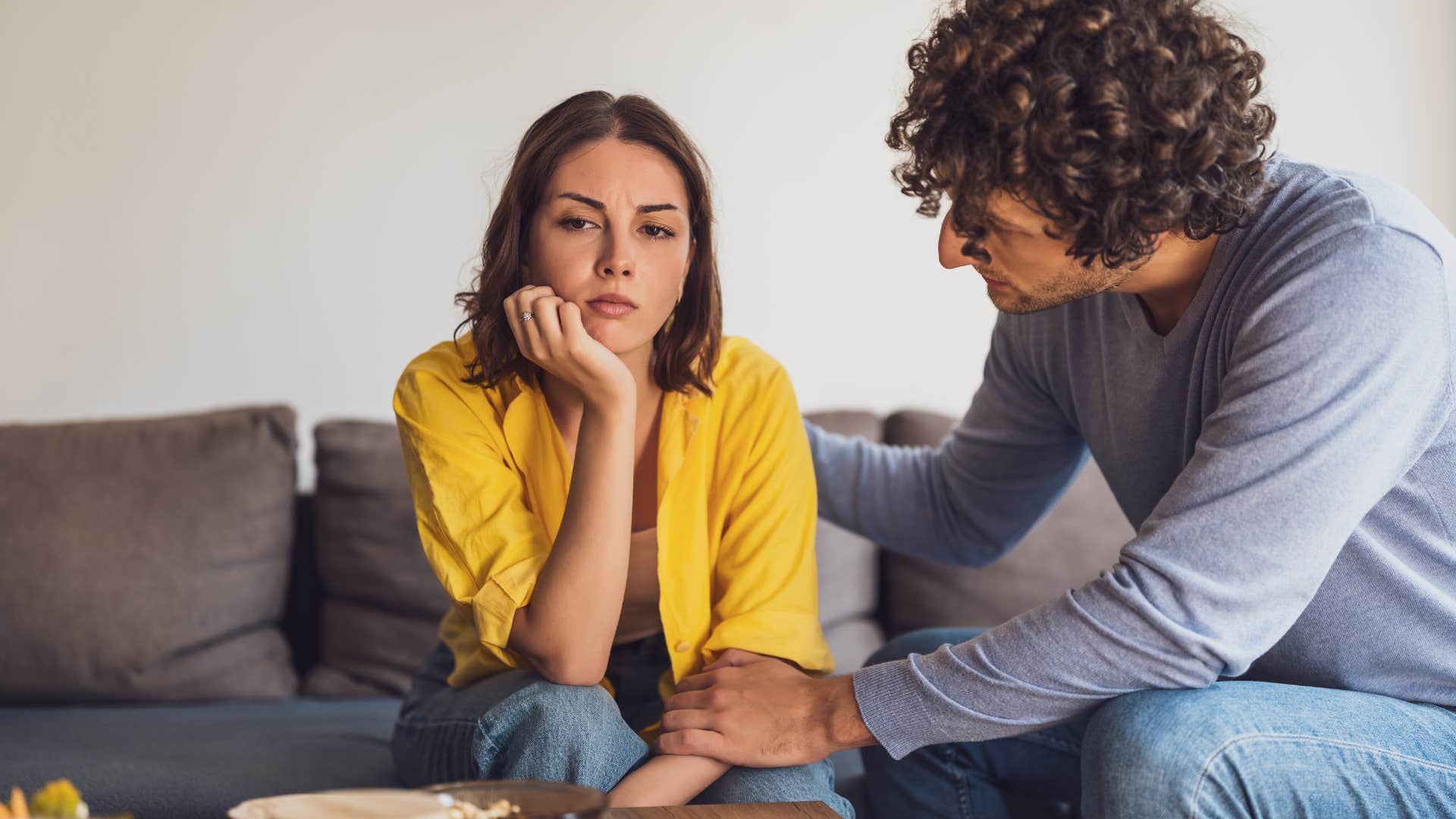 husband trying to comfort upset wife