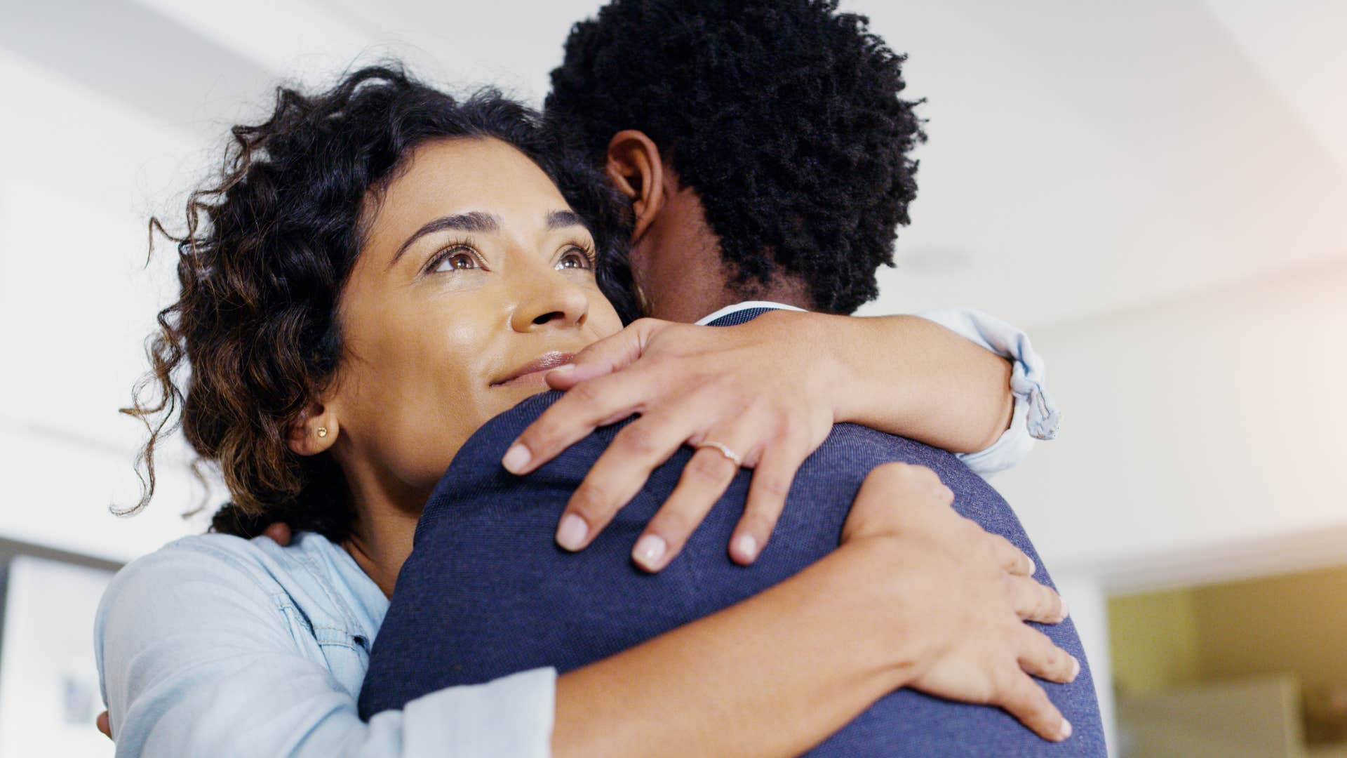 woman hugging her husband peacefully