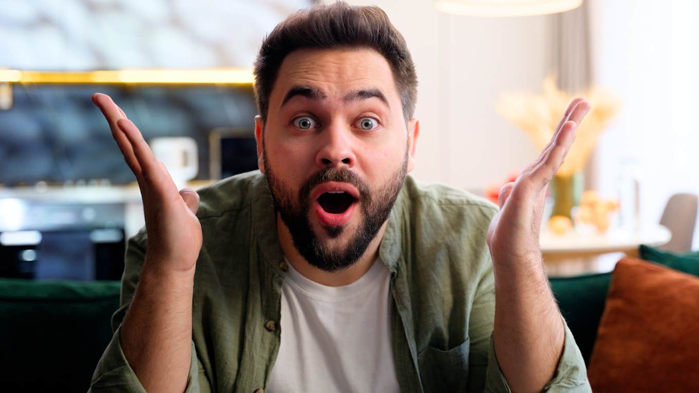 Shocked man looking at the camera showing what men learned from their female roommates about the creepy stuff women face.