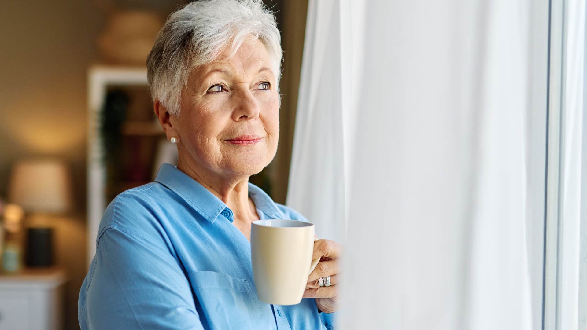 happy calm woman drinking tea
