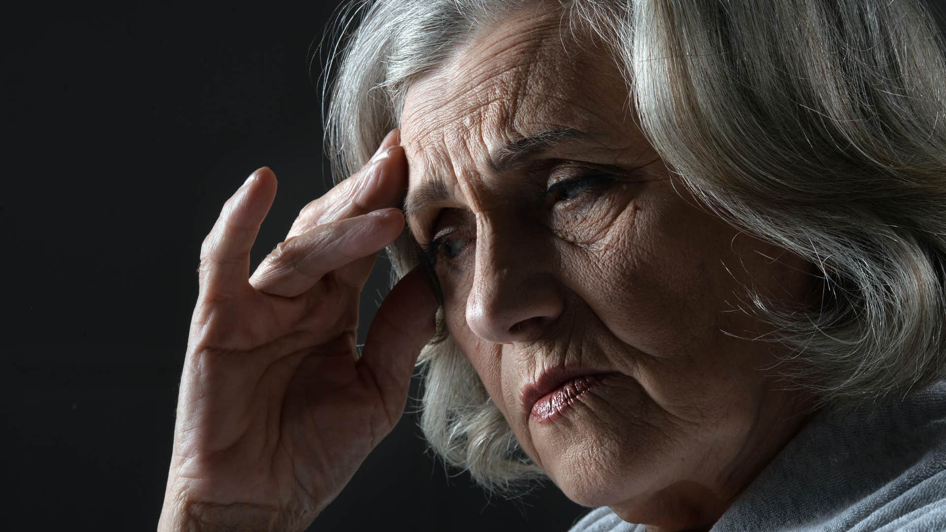 sad older woman feeling deep loneliness