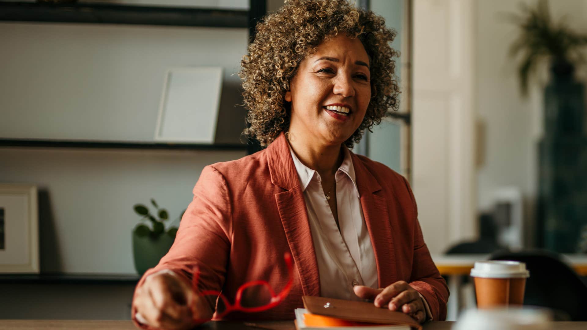 Woman saying "let's take some time to decompress" at work.