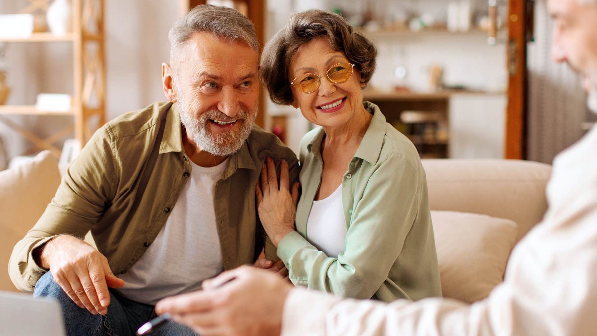 woman sitting with her husband giving him grace