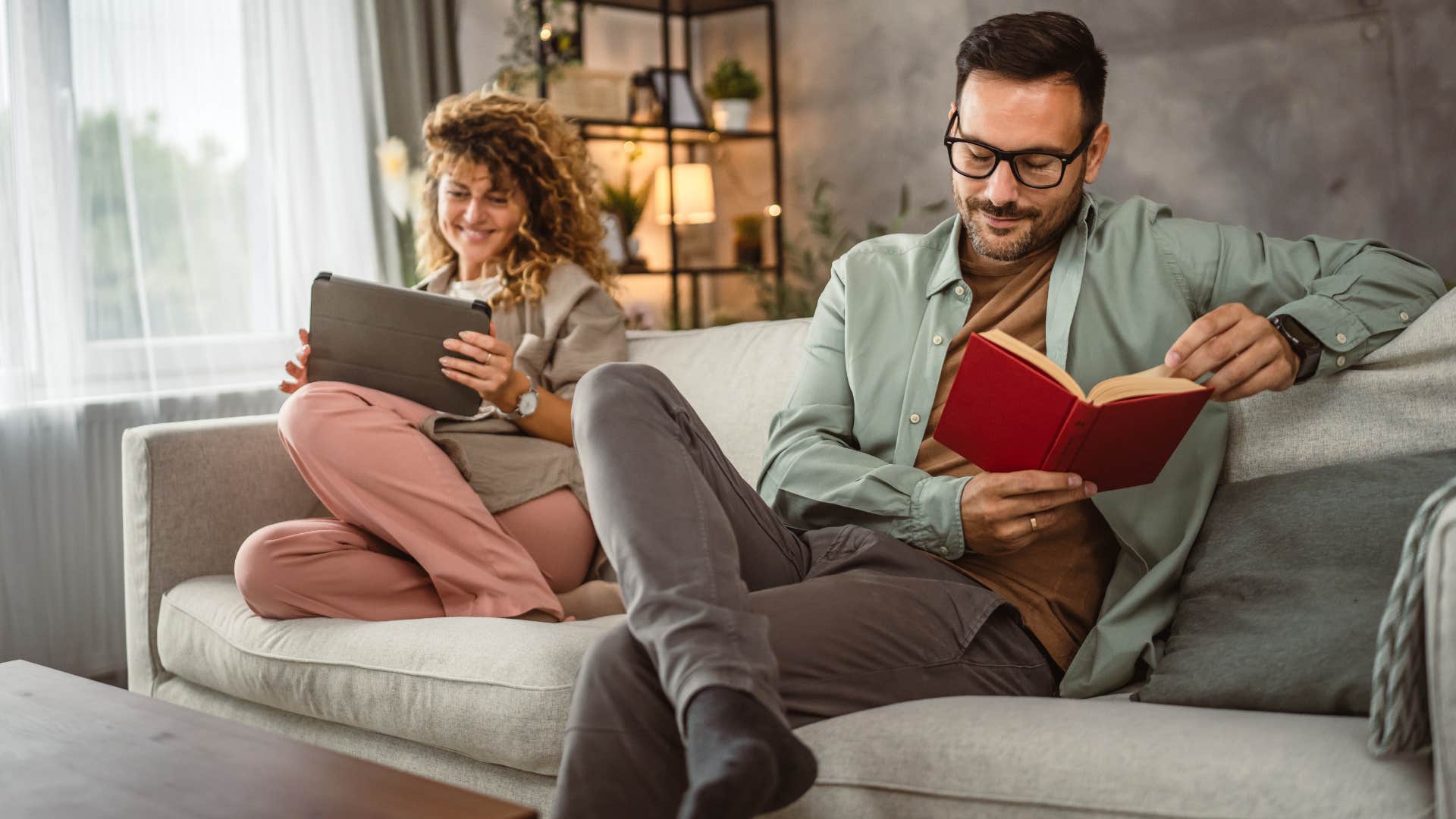 couple feeling comfortable sitting in silence reading together