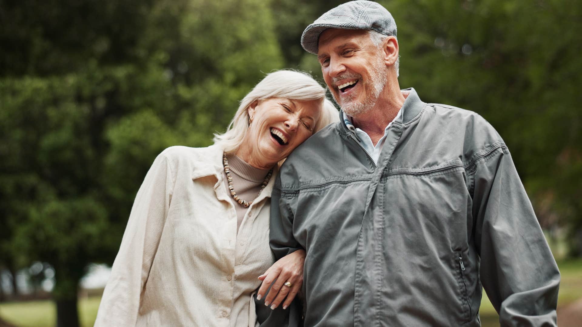 older couple laughing together outside