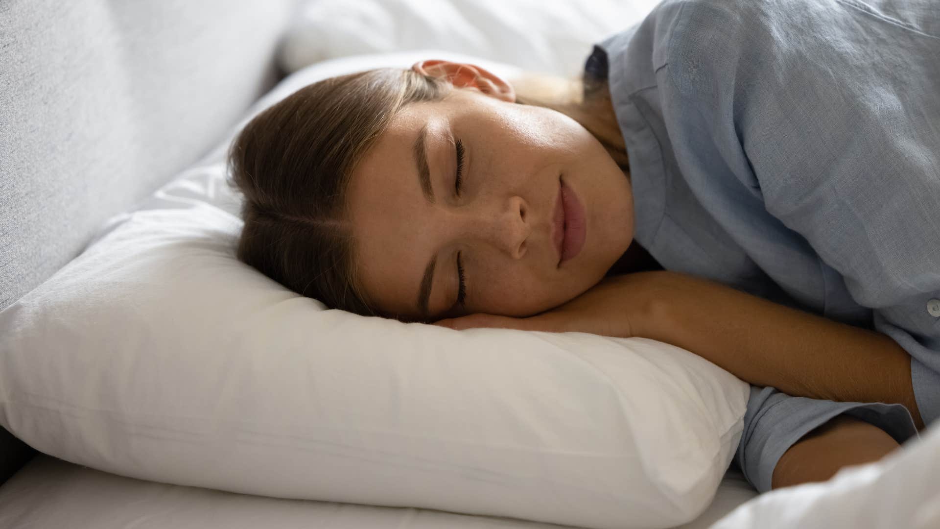 woman disconnected from her phone sleeping