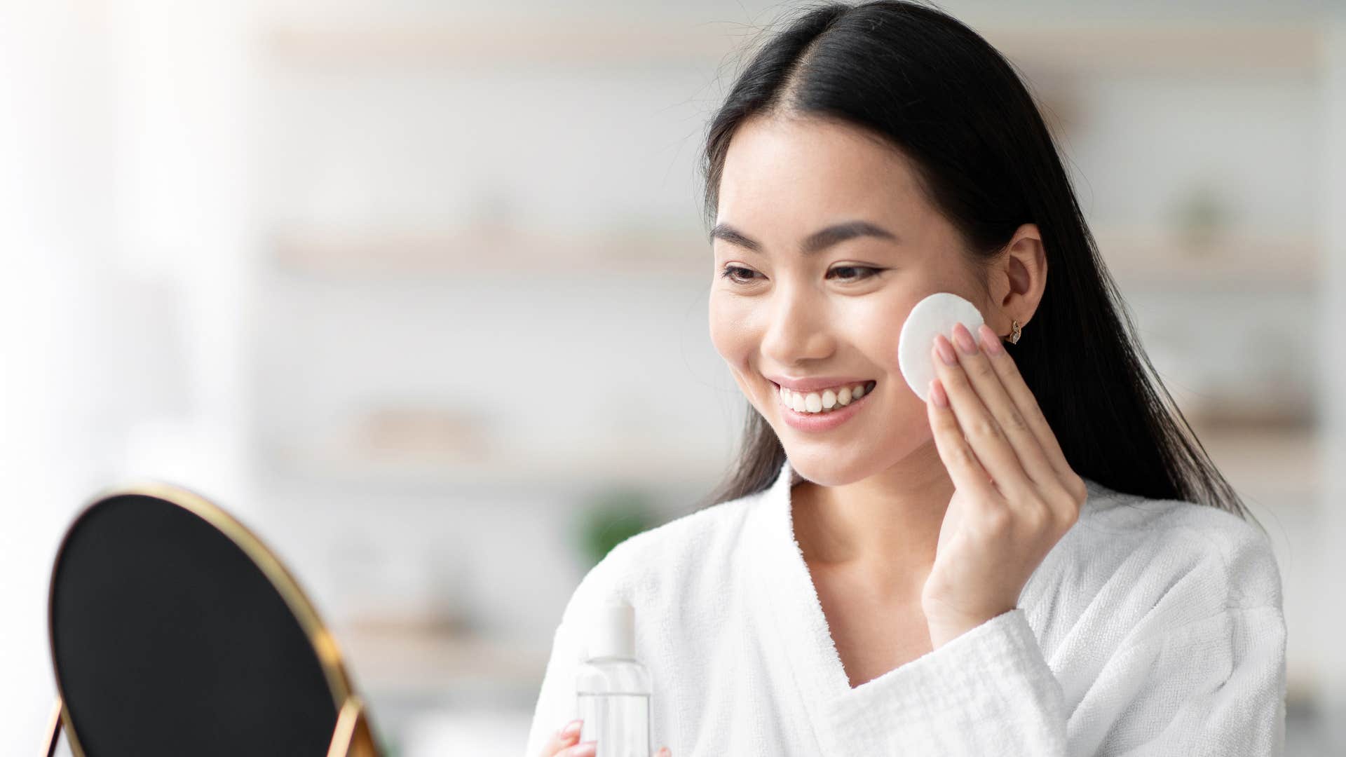 tired woman doing her skincare routine before bed