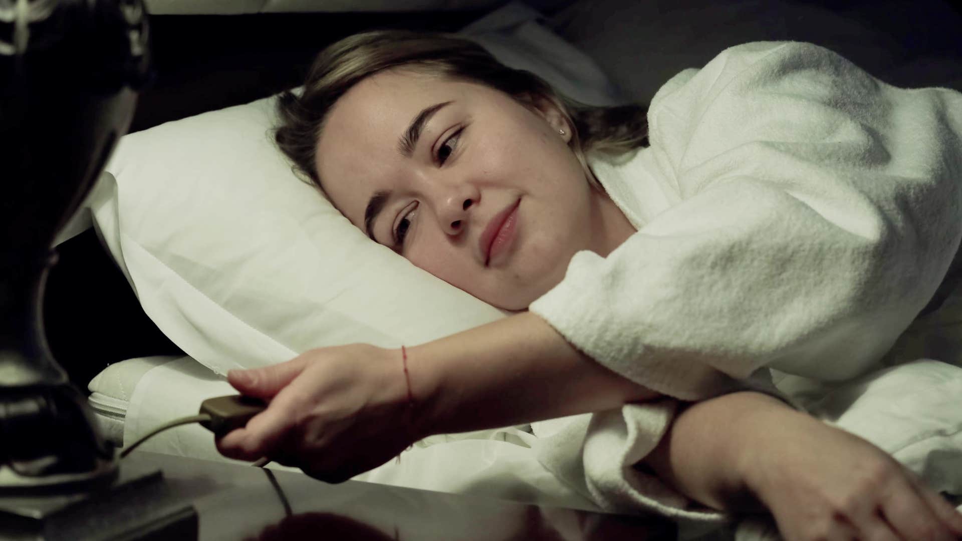 woman who goes to bed at the same time smiling