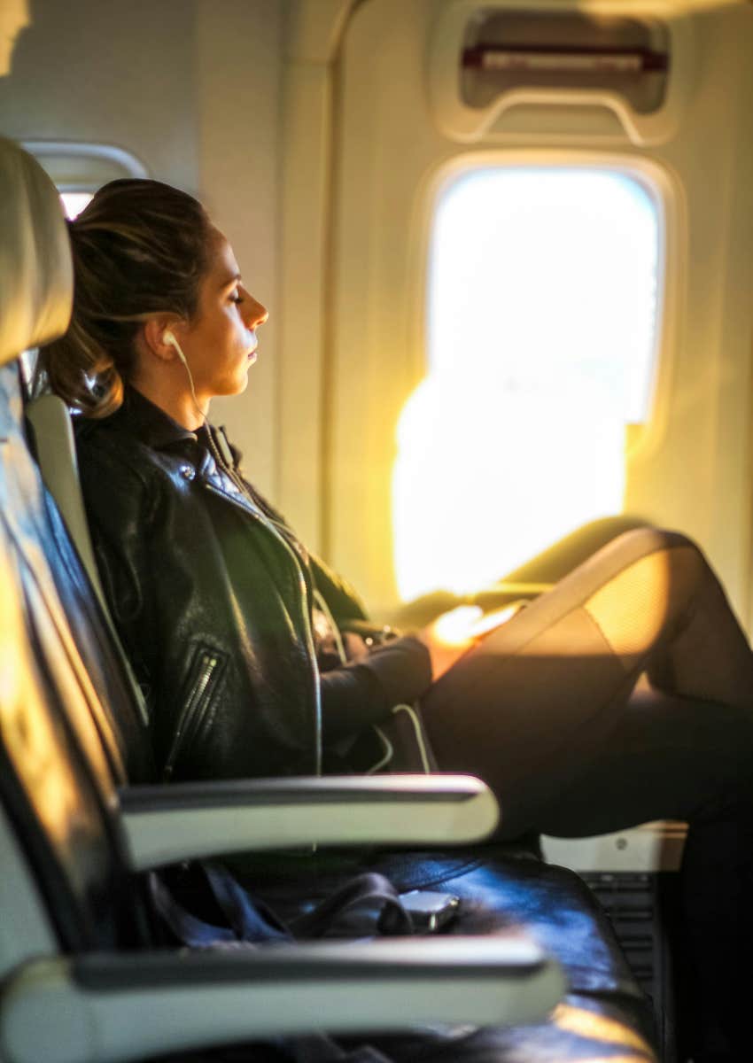 woman sitting on a plane