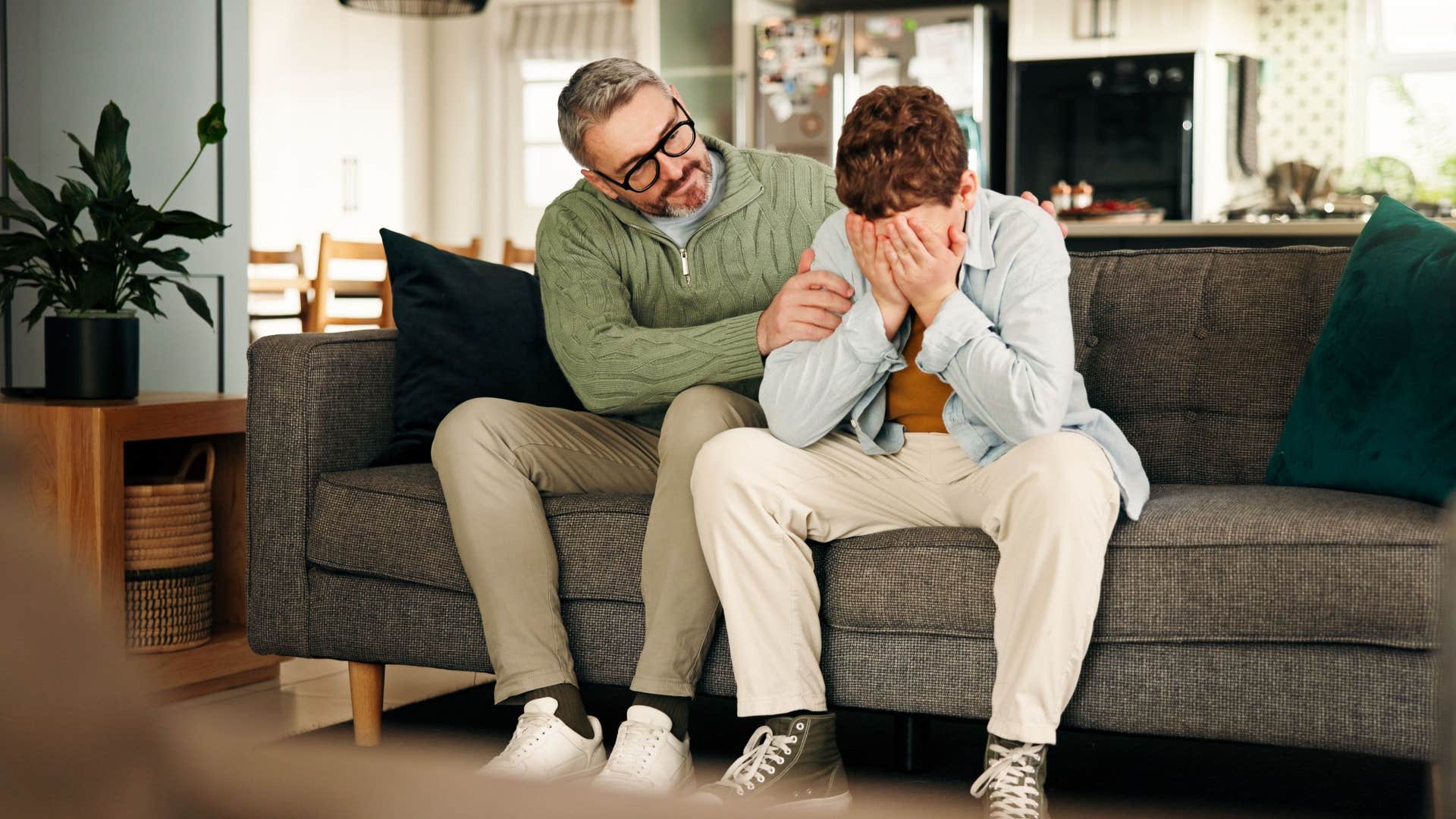 man telling his son its okay to cry 