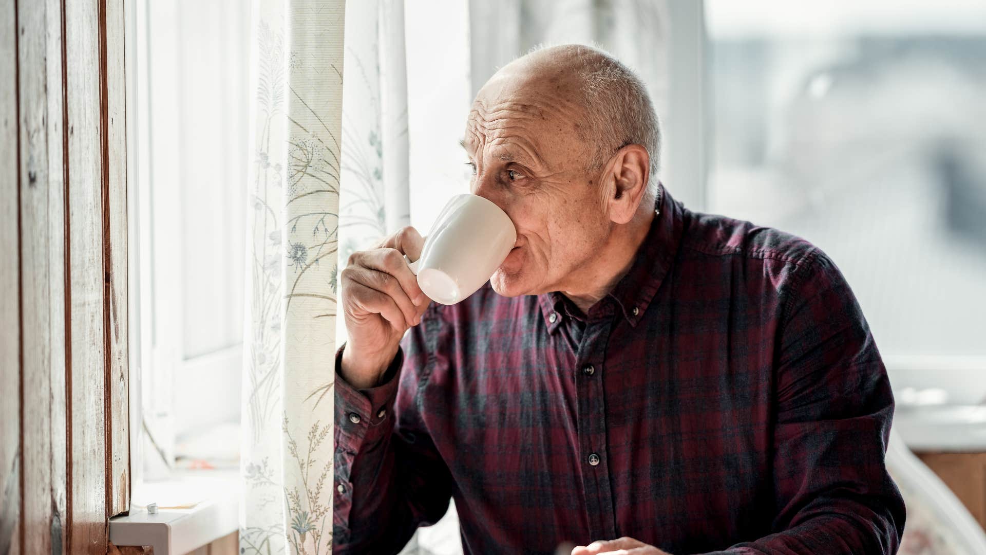 older man drinking tea to relax