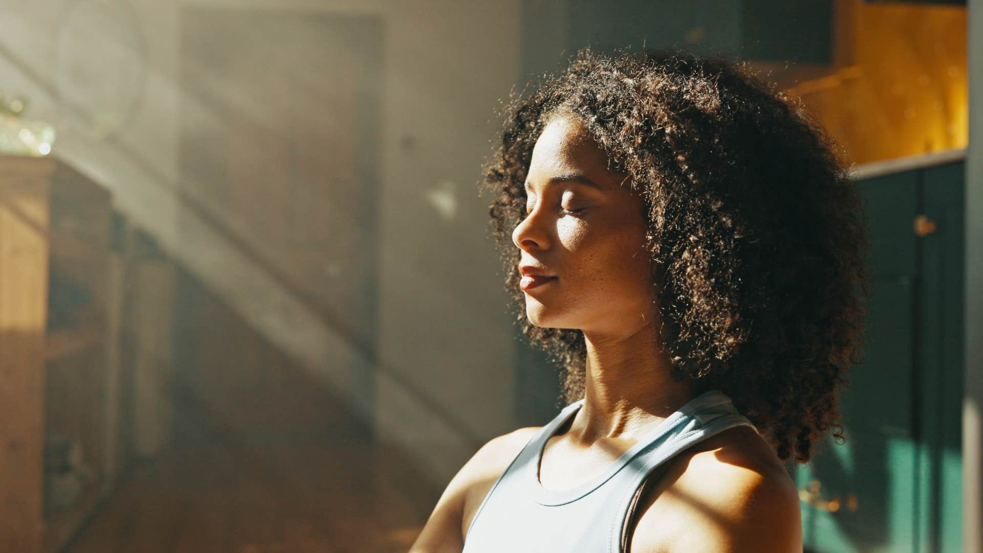 woman meditating in the morning sun