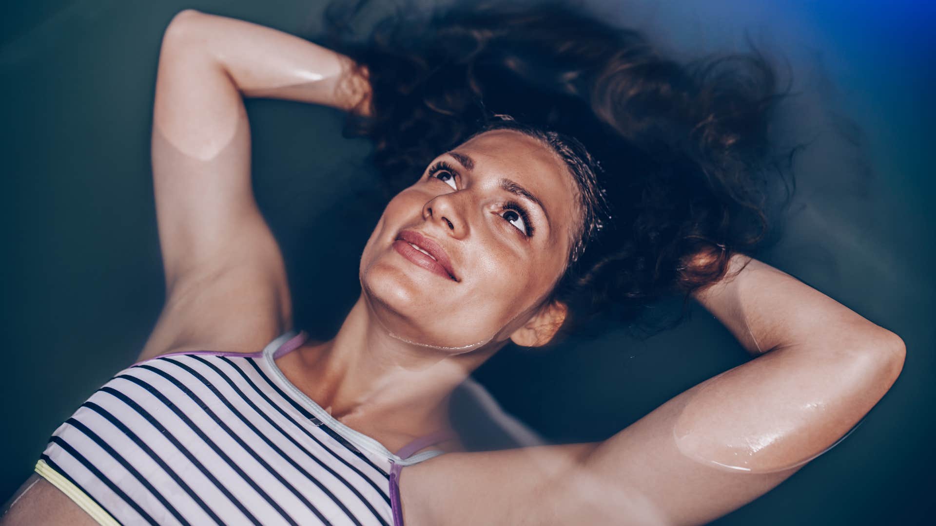 woman relaxing in a sensory deprivation tank