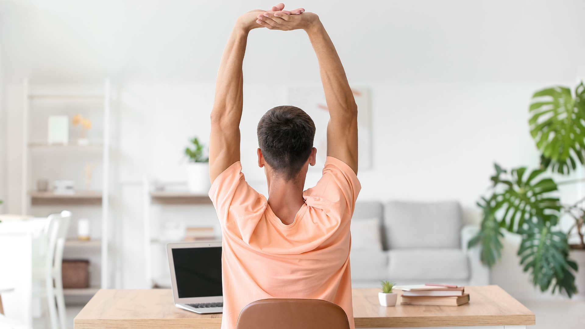 person stretching during day at work
