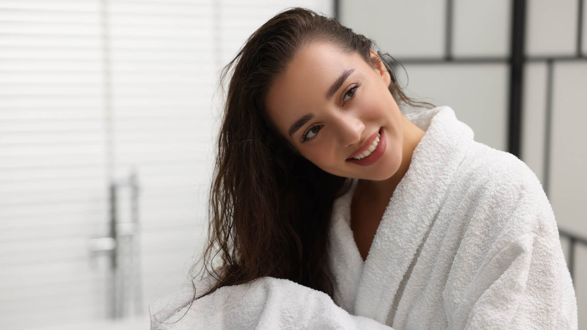 woman in robe fresh out of a bathtub soak
